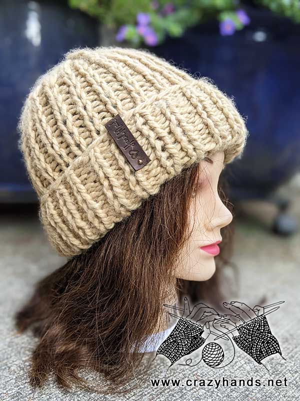 super bulky knit hat with double brim on the woman's mannequin 