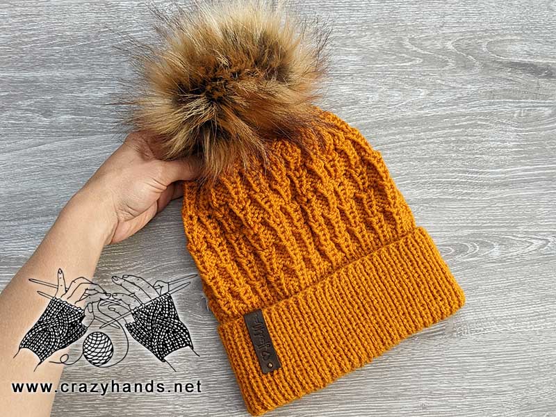 torch knit hat made with mustard color yarn