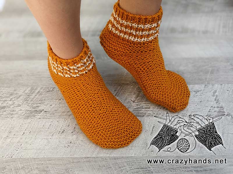 two flat knit socks on model's feet