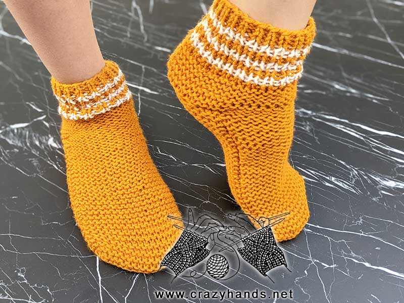 two needle knit socks on the feet