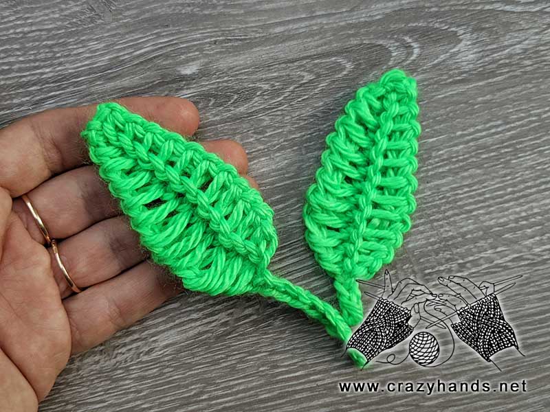 two crochet feathers arranged side by side