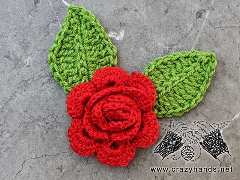 two crochet leaves and crochet red rose flower