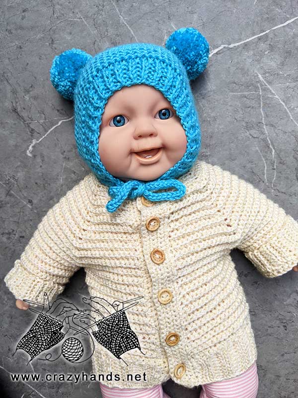 blue baby bear knit bonnet with two poms and ties