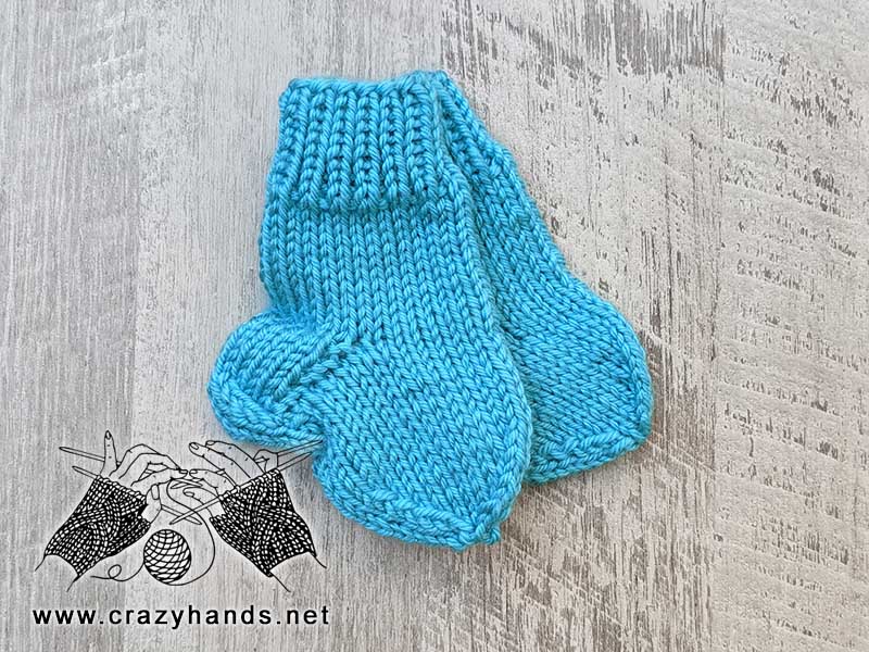 preemie newborn baby knit socks made with light blue yarn