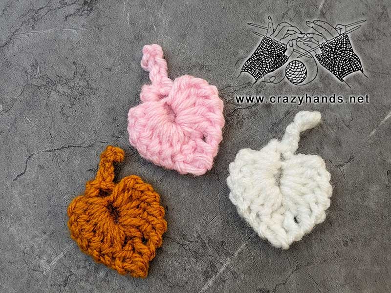 three crochet small leaves - brown, white, pink