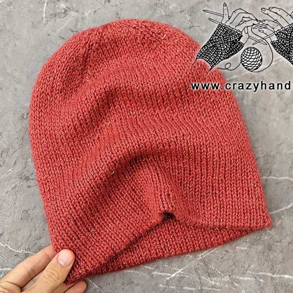 reversible double layer knit hat made using red pastel yarn