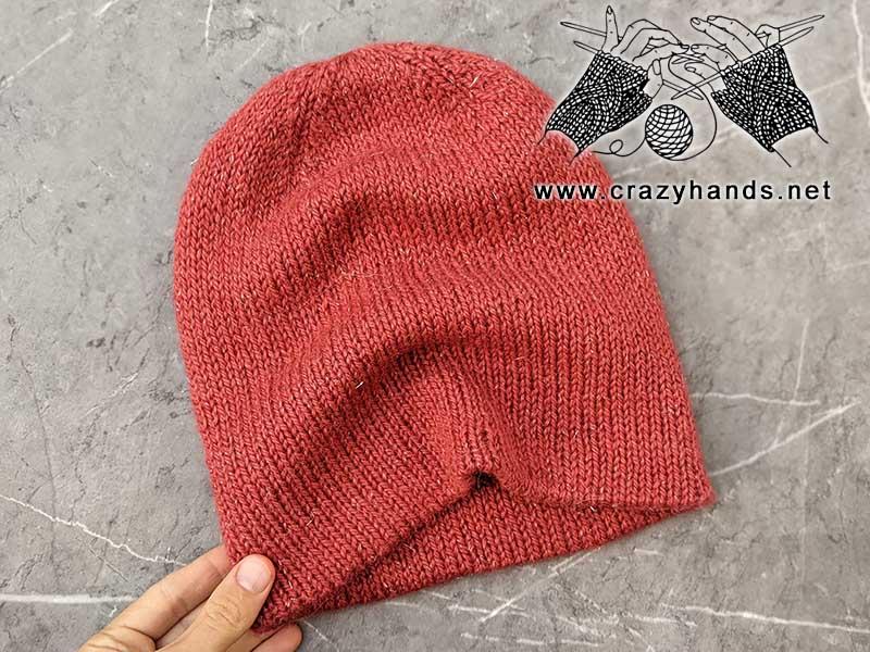 reversible double layer knit hat made using red pastel yarn