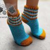 knit two-needles slipper socks on female model's feet