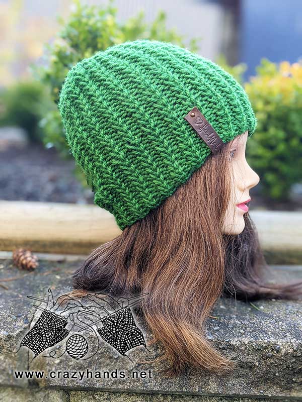 Evergreen ribbed beanie knit on circular needles shot on the mannequin