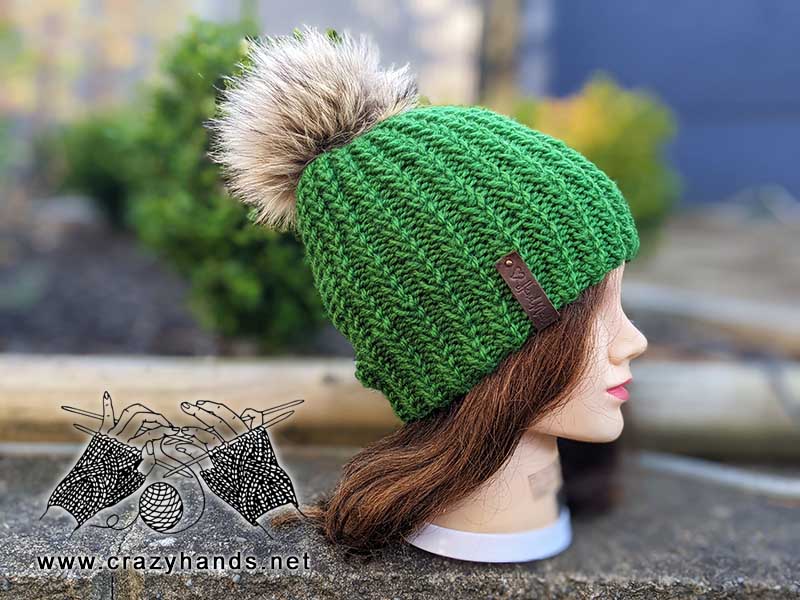 Evergreen chunky ribbed knit beanie on a mannequin