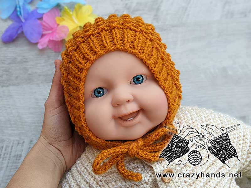 Fruity Knit Bonnet Shot on a Baby Doll