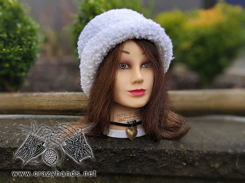 crochet white bucket beanie with brim - side shot on the mannequin