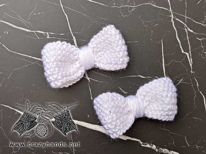 Two knit bows side by side