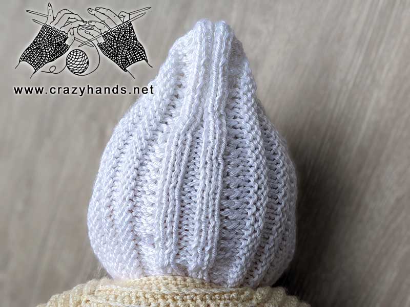 knit newborn baby pixie hat shot on the doll - back side view