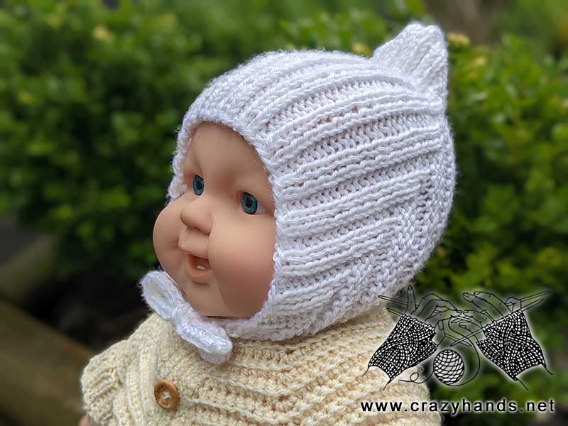 knit newborn baby pixie hat made with white yarn