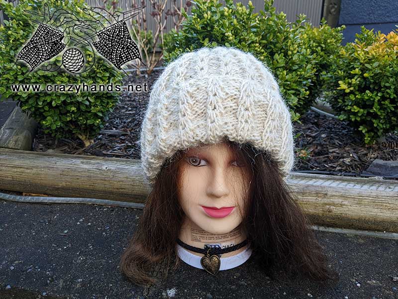 sage knit hat on the mannequin head - front side view 