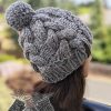 chunky knit cable beanie on the mannequin's head - side view