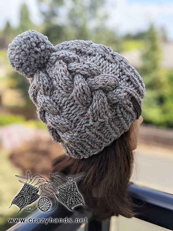 chunky knit cable beanie on the mannequin's head - side view