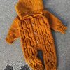 knitting pattern of aran baby romper designed for all sizes