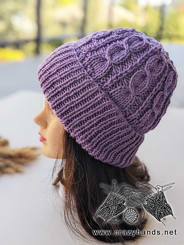 viola knit cable hat on the mannequin's head