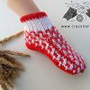 flat knit christmas sock on a female foot