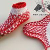 flat knit christmas slipper socks - one sock is assembled, and another one is flat