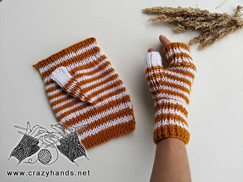 flat knit fingerless gloves - one glove is flat (unfinished) and another one is on the female hand
