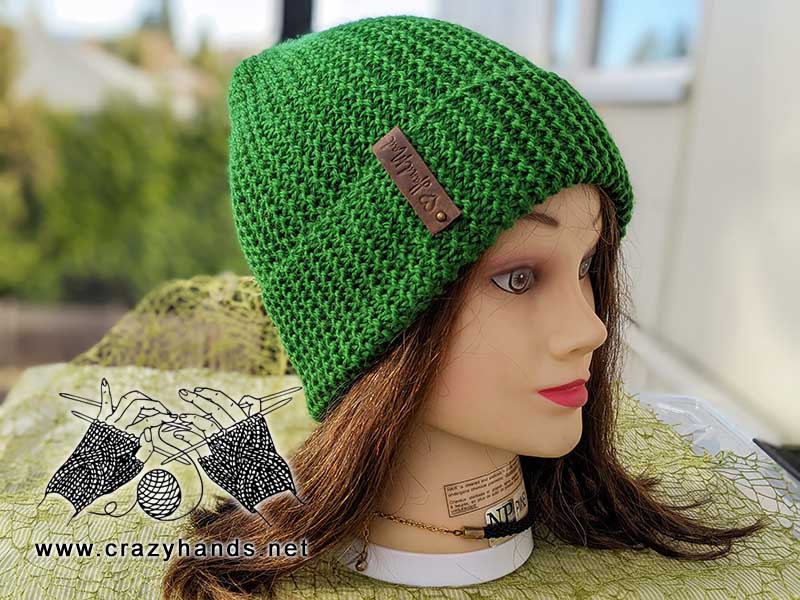 flat knit slouchy beanie on the mannequin's head - side view