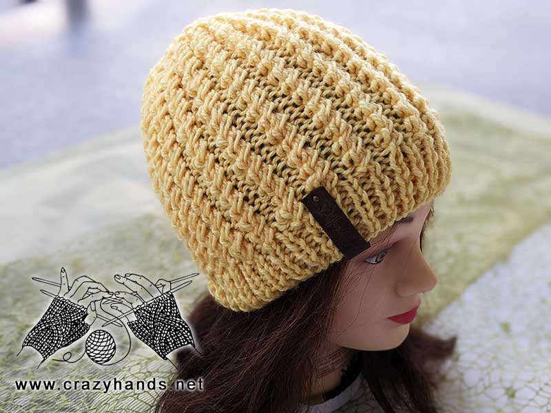 flat knit classic beanie on the mannequin's head