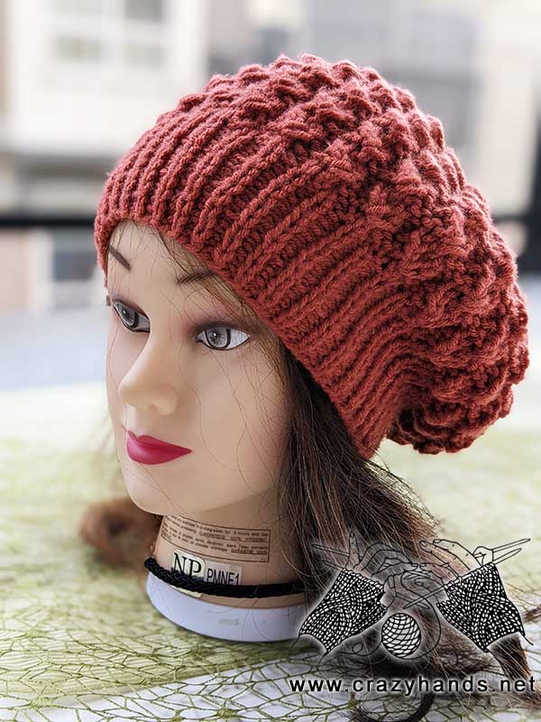 flat knit classic beret on mannequin's head - front view