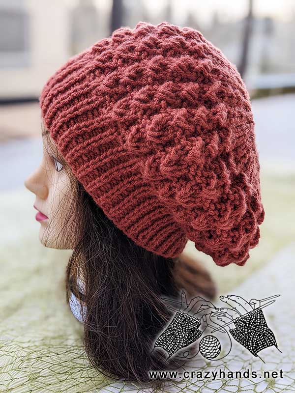 flat knit classic beret on the mannequin's head - side view