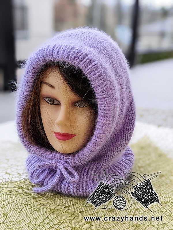 knitting pattern of a hooded scarf shown on the mannequin head