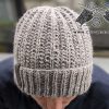 unisex winter knit hat on the male model - front side view