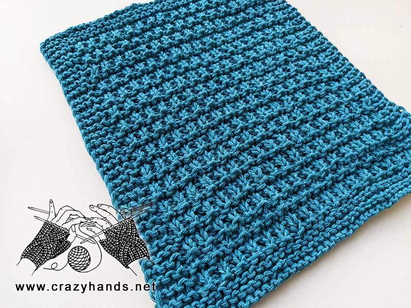 knit kitchen towel made using mangrove stitch and blue color yarn