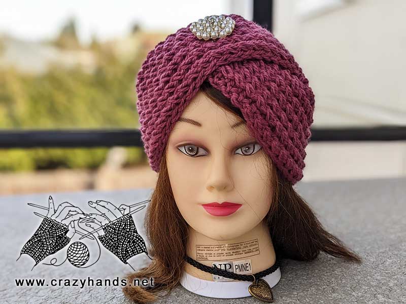 knit turban hat on the mannequin's head - front view