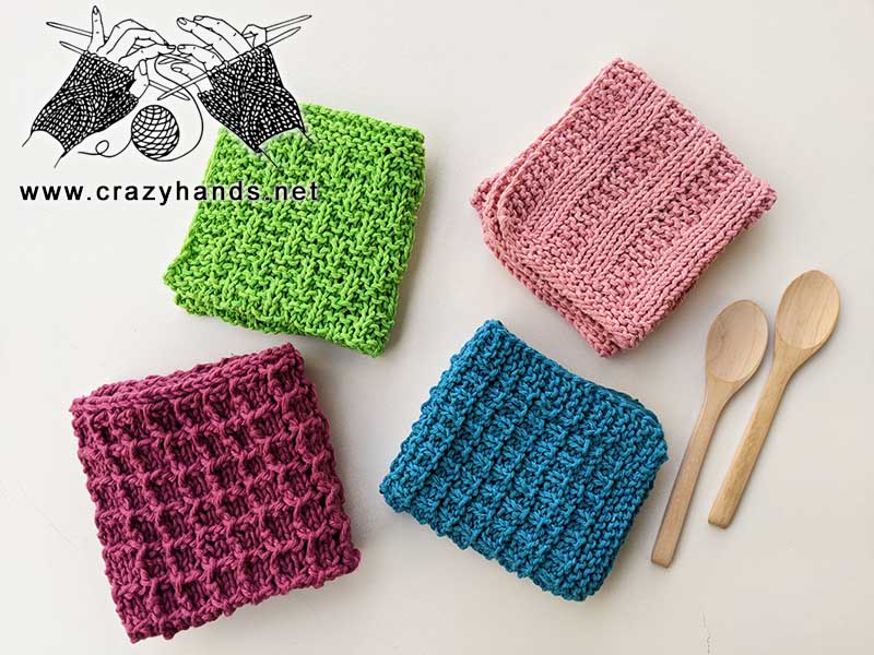 set of four knit dish towels made using green, violet, pink, and navy blue yarn colors