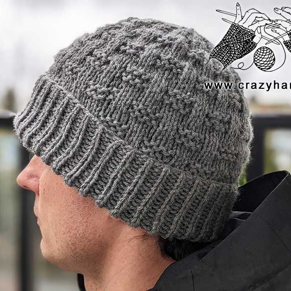 easy knit hat pattern for men. The hat has a folder brim and a stylish design. Photo made from the left side on a male model.