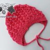 lace knit newborn baby bonnet, frontal view, orange yarn