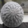 crown of the men's knit hat shot on a male model; top view