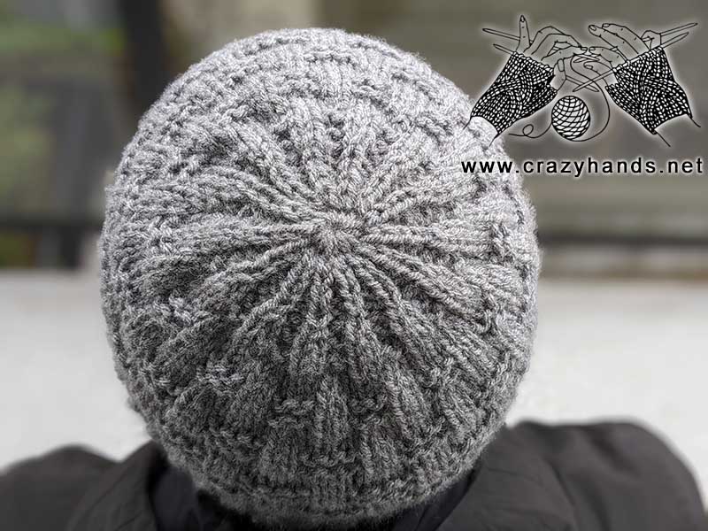 crown of the men's knit hat shot on a male model; top view
