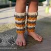 baby knit leg warmers on a baby model - front view