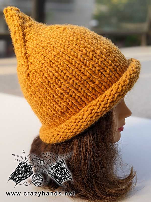 knit pointy witch hat on a female mannequin head