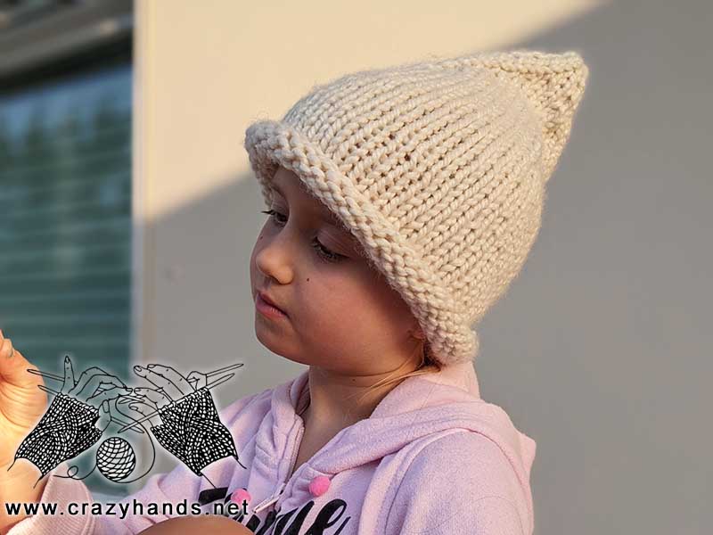 pointy witch knit hat on a toddler girl