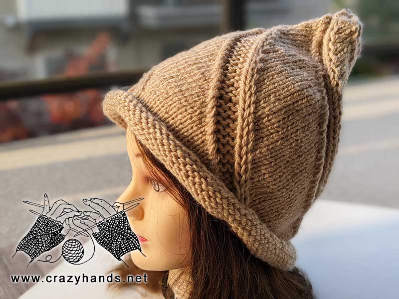 swirl knit hat on the mannequin head - side view