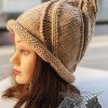 swirl witch knit hat on the female mannequin head