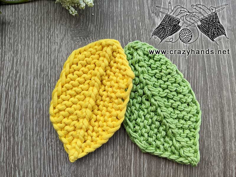 knit autumn leaves - one yellow and one green