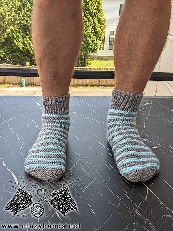 flat knit two needles two-color socks on male's feet - front view