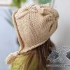 knit owl hat on baby girl - side view