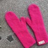 knit Barbie-style pink mittens