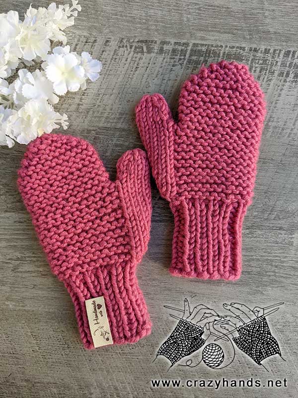 a pair of mittens knitted for a child 4-5 years old